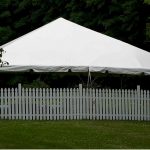 30'x30' Frame Tent Behind Fence