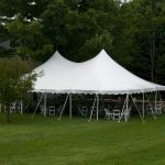 30'x45' Pole Tent with white party chairs