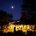 30'x60' Frame Tent and 2- 20'x20' Frame Tents at Night During Wedding