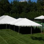 30'x60' Frame Tent with married 20'x30' Frame Tent and offset 20'x20' Frame Tent by tennis court