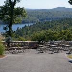 Samsonite Folding Chairs setup for a Wedding Ceremony with lake in background