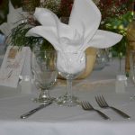 Simple Buffet Table Setting with Water Goblet, Wine Glass, and White Napkin set prior to a wedding