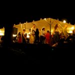 Tent at Night with People Dancing