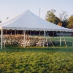 White Party Chairs set for Wedding Ceremony under a Tent